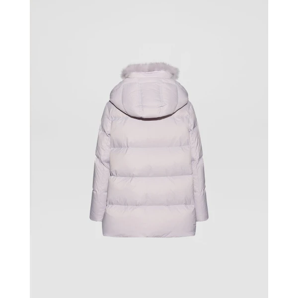 Woman wearing Yves Salomon shearling fur coat – luxury outerwear at Coveti