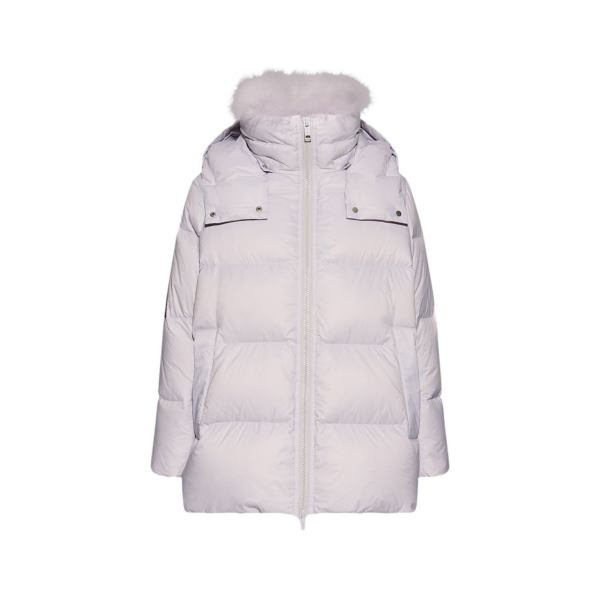 Woman wearing Yves Salomon shearling fur coat – luxury outerwear at Coveti