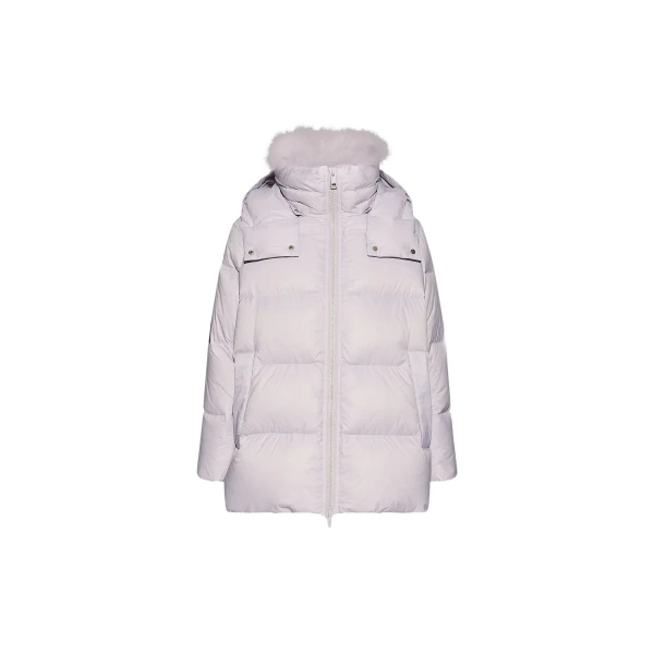 Woman wearing Yves Salomon shearling fur coat – luxury outerwear at Coveti