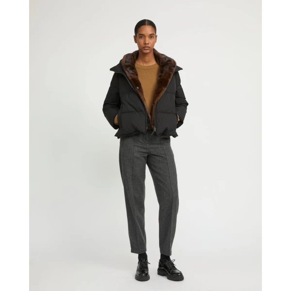 Woman wearing Yves Salomon shearling fur coat – luxury outerwear at Coveti