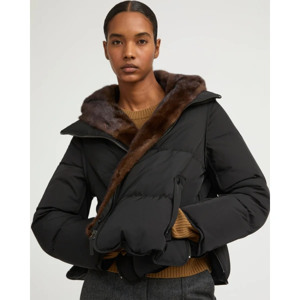 Woman wearing Yves Salomon shearling fur coat – luxury outerwear at Coveti