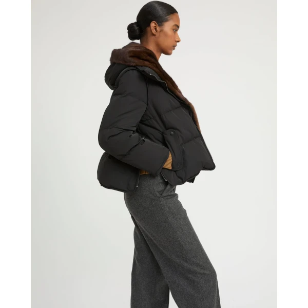 Woman wearing Yves Salomon shearling fur coat – luxury outerwear at Coveti