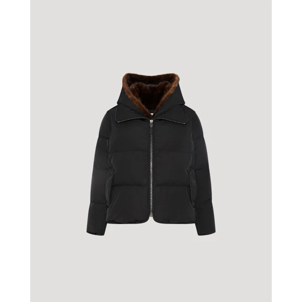 Woman wearing Yves Salomon shearling fur coat – luxury outerwear at Coveti
