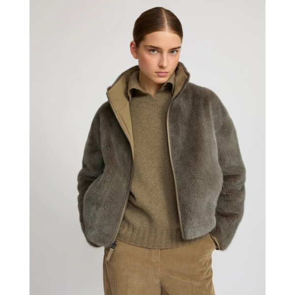 Woman wearing Yves Salomon shearling fur coat – luxury outerwear at Coveti