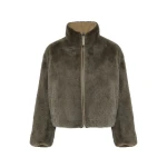 Woman wearing Yves Salomon shearling fur coat – luxury outerwear at Coveti