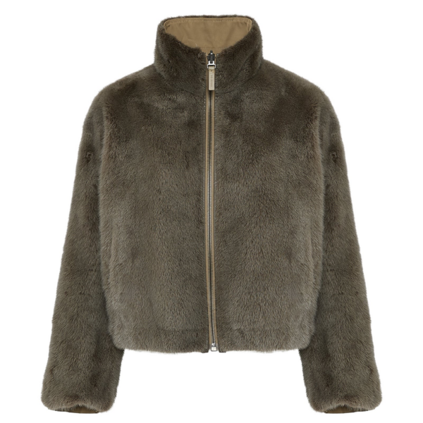 Woman wearing Yves Salomon shearling fur coat – luxury outerwear at Coveti