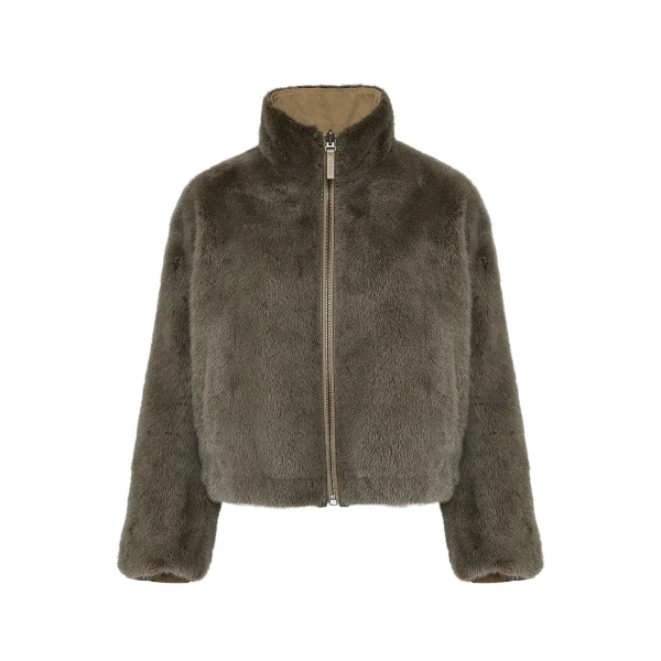 Woman wearing Yves Salomon shearling fur coat – luxury outerwear at Coveti