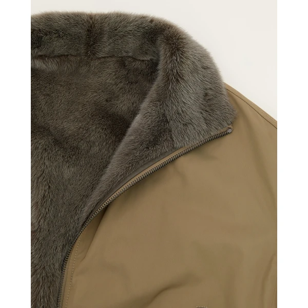 Woman wearing Yves Salomon shearling fur coat – luxury outerwear at Coveti