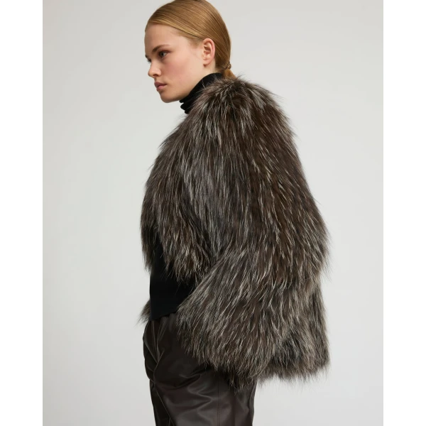 Woman wearing Yves Salomon shearling fur coat – luxury outerwear at Coveti