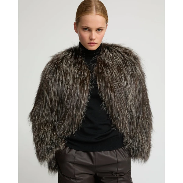 Woman wearing Yves Salomon shearling fur coat – luxury outerwear at Coveti