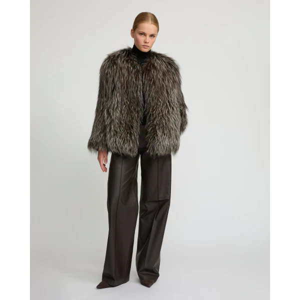 Woman wearing Yves Salomon shearling fur coat – luxury outerwear at Coveti