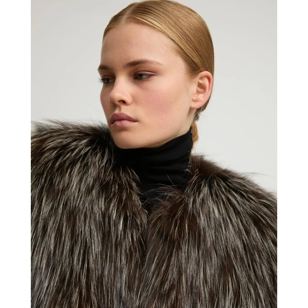 Woman wearing Yves Salomon shearling fur coat – luxury outerwear at Coveti