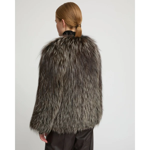 Woman wearing Yves Salomon shearling fur coat – luxury outerwear at Coveti