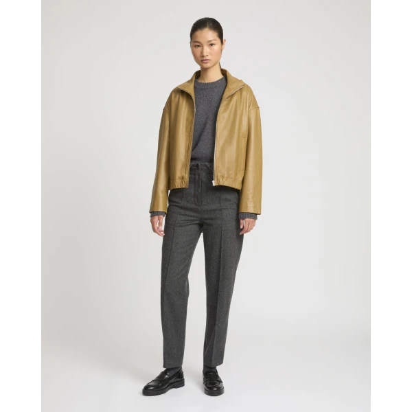 Woman wearing Yves Salomon shearling fur coat – luxury outerwear at Coveti
