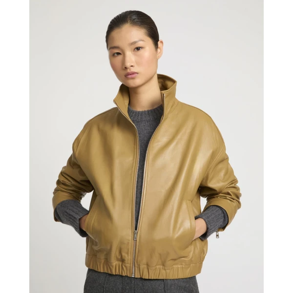 Woman wearing Yves Salomon shearling fur coat – luxury outerwear at Coveti