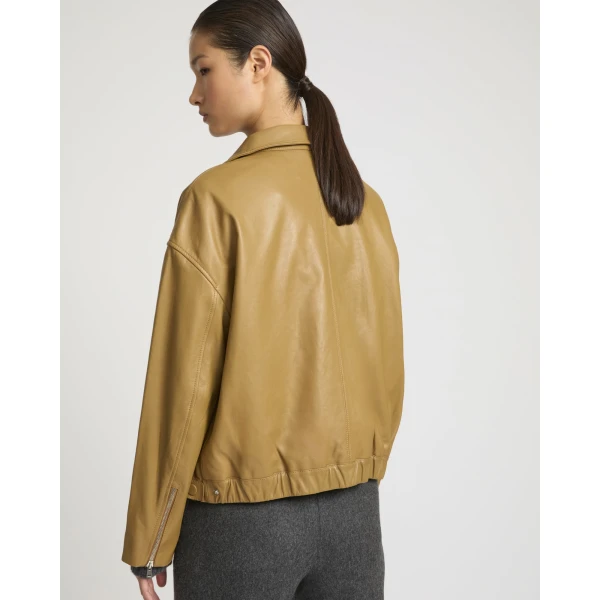 Woman wearing Yves Salomon shearling fur coat – luxury outerwear at Coveti