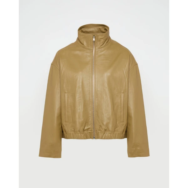 Woman wearing Yves Salomon shearling fur coat – luxury outerwear at Coveti