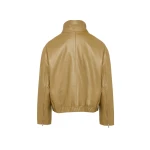 Woman wearing Yves Salomon shearling fur coat – luxury outerwear at Coveti