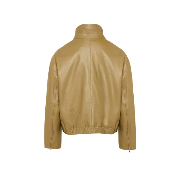 Woman wearing Yves Salomon shearling fur coat – luxury outerwear at Coveti