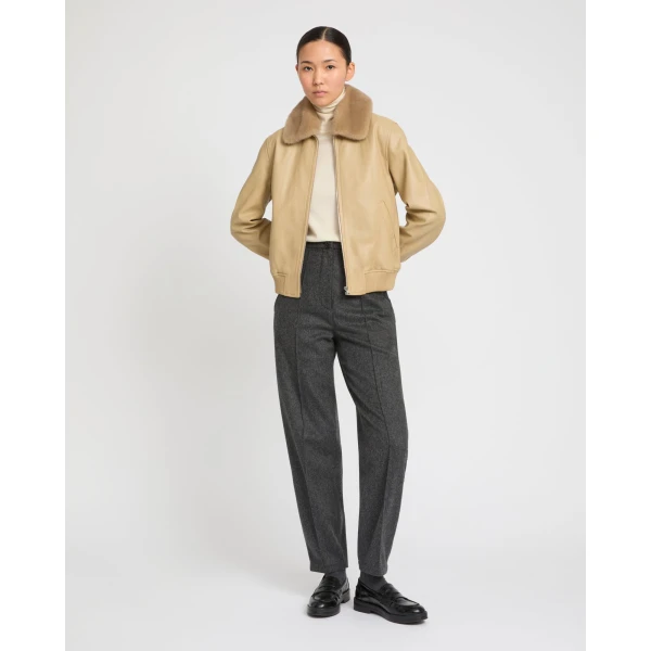 Woman wearing Yves Salomon shearling fur coat – luxury outerwear at Coveti