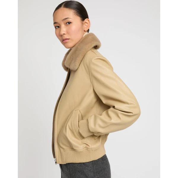 Woman wearing Yves Salomon shearling fur coat – luxury outerwear at Coveti
