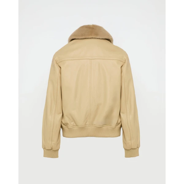 Woman wearing Yves Salomon shearling fur coat – luxury outerwear at Coveti