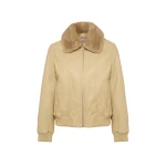 Woman wearing Yves Salomon shearling fur coat – luxury outerwear at Coveti