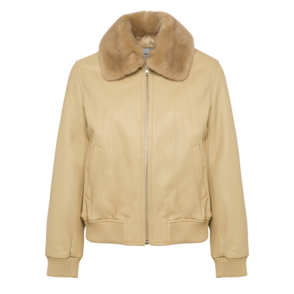 Woman wearing Yves Salomon shearling fur coat – luxury outerwear at Coveti