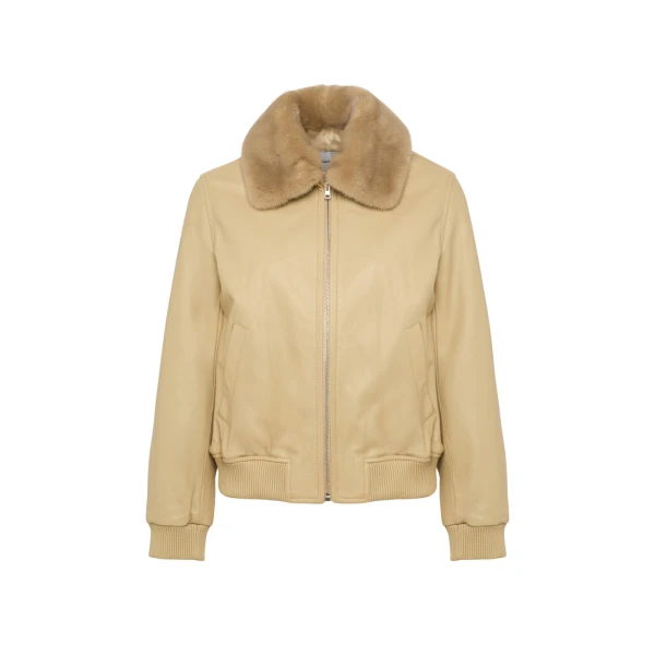 Woman wearing Yves Salomon shearling fur coat – luxury outerwear at Coveti