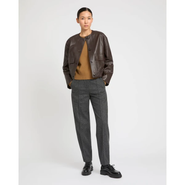 Woman wearing Yves Salomon shearling fur coat – luxury outerwear at Coveti