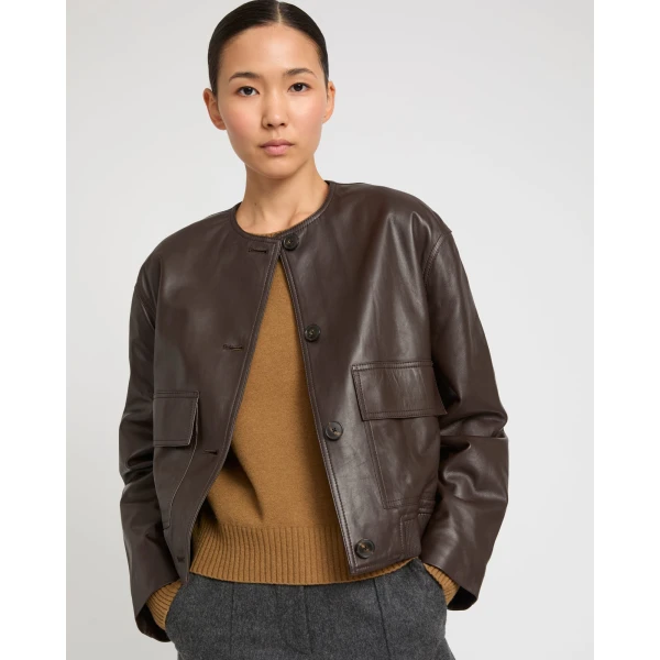 Woman wearing Yves Salomon shearling fur coat – luxury outerwear at Coveti