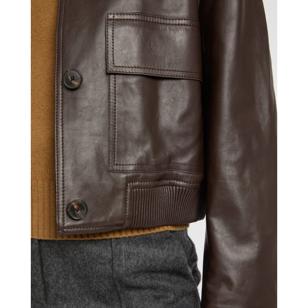 Woman wearing Yves Salomon shearling fur coat – luxury outerwear at Coveti