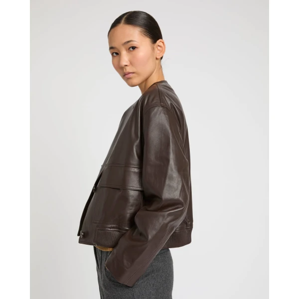 Woman wearing Yves Salomon shearling fur coat – luxury outerwear at Coveti