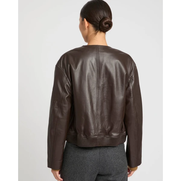 Woman wearing Yves Salomon shearling fur coat – luxury outerwear at Coveti