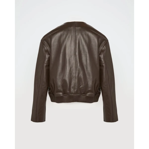 Woman wearing Yves Salomon shearling fur coat – luxury outerwear at Coveti