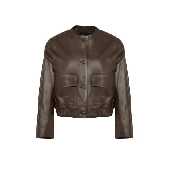 Woman wearing Yves Salomon shearling fur coat – luxury outerwear at Coveti