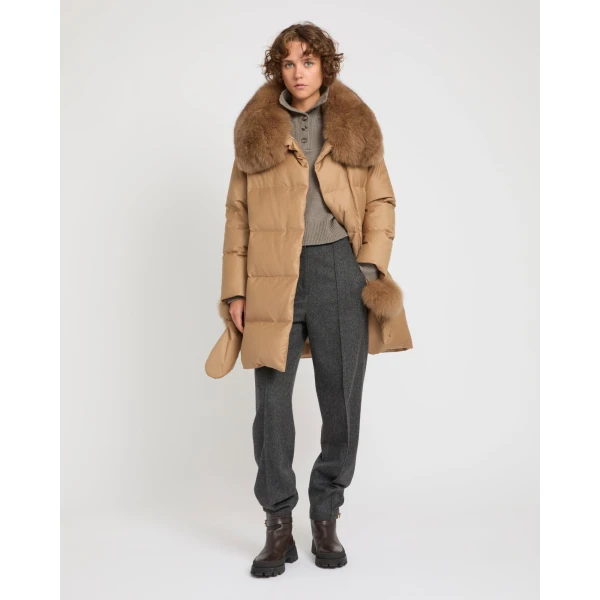 Woman wearing Yves Salomon shearling fur coat – luxury outerwear at Coveti