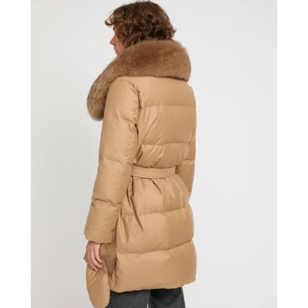 Woman wearing Yves Salomon shearling fur coat – luxury outerwear at Coveti