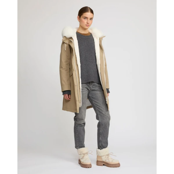 Woman wearing Yves Salomon shearling fur coat – luxury outerwear at Coveti