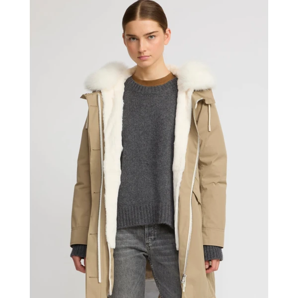 Woman wearing Yves Salomon shearling fur coat – luxury outerwear at Coveti