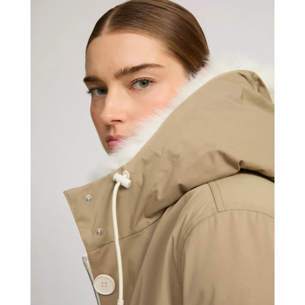 Woman wearing Yves Salomon shearling fur coat – luxury outerwear at Coveti
