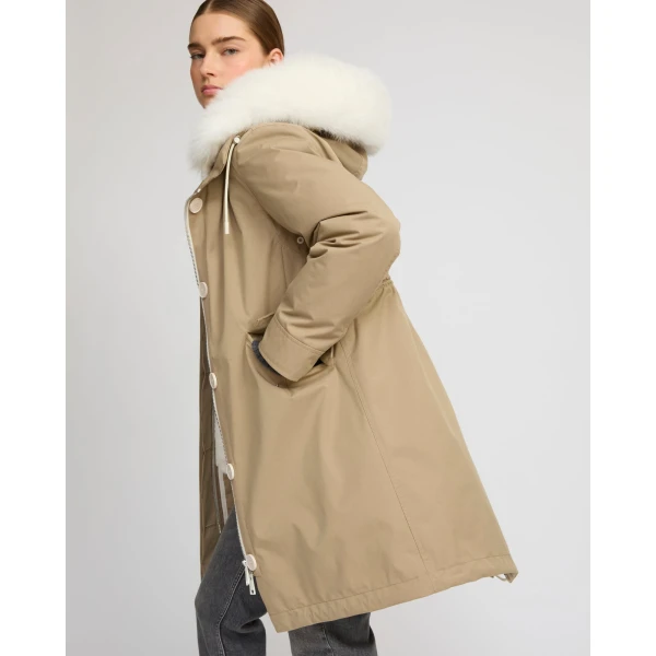 Woman wearing Yves Salomon shearling fur coat – luxury outerwear at Coveti