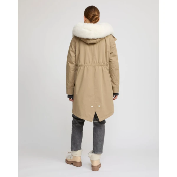 Woman wearing Yves Salomon shearling fur coat – luxury outerwear at Coveti