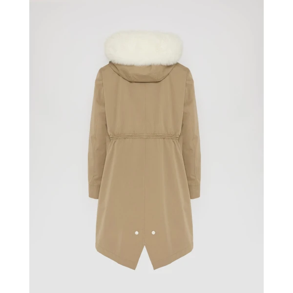 Woman wearing Yves Salomon shearling fur coat – luxury outerwear at Coveti