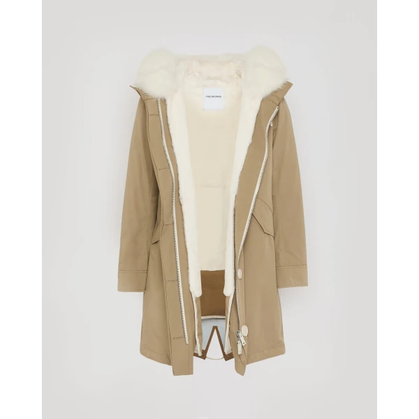 Woman wearing Yves Salomon shearling fur coat – luxury outerwear at Coveti