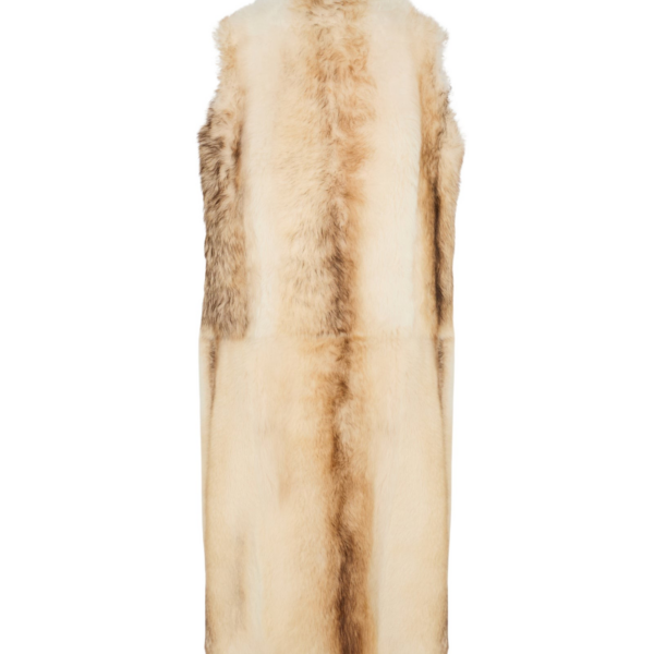 Woman wearing Yves Salomon shearling fur coat – luxury outerwear at Coveti