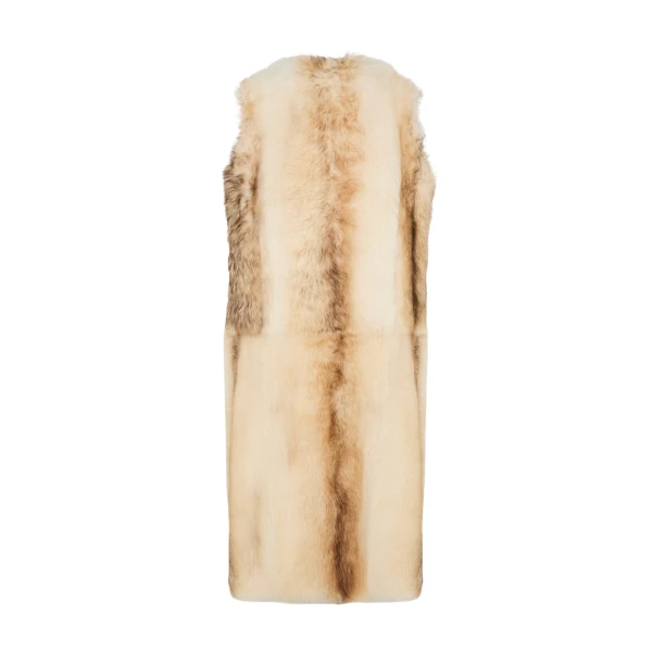 Woman wearing Yves Salomon shearling fur coat – luxury outerwear at Coveti
