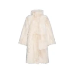 Woman wearing Yves Salomon shearling fur coat – luxury outerwear at Coveti