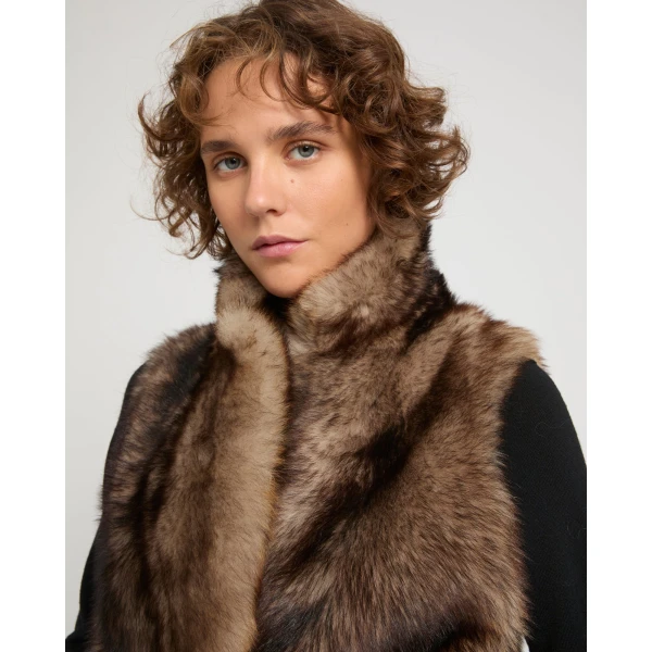 Woman wearing Yves Salomon shearling fur coat – luxury outerwear at Coveti