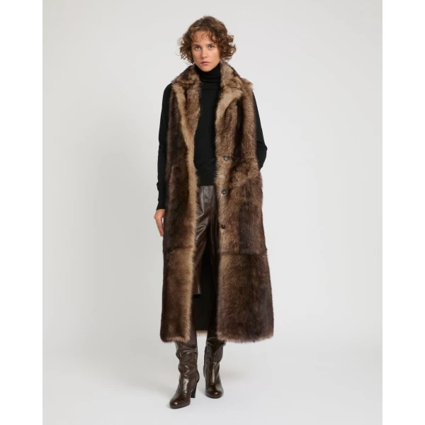 Woman wearing Yves Salomon shearling fur coat – luxury outerwear at Coveti